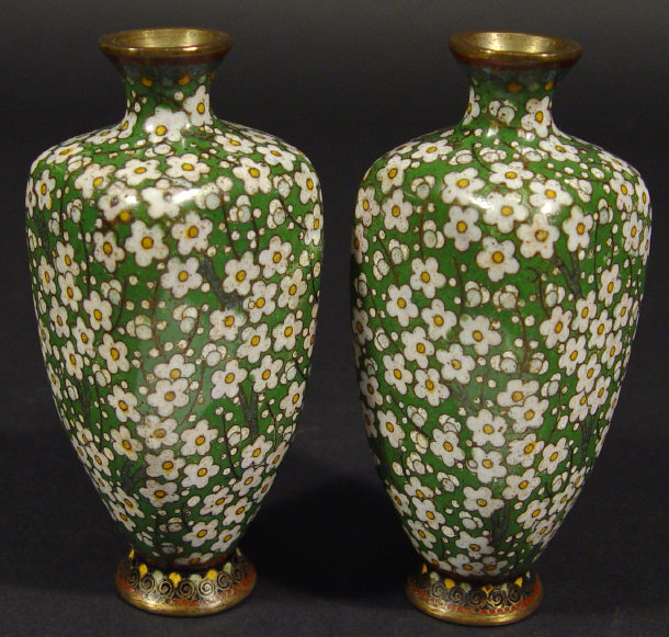 Appraisal: Pair of Oriental four-sided cloisonn vases enamelled with white flowers