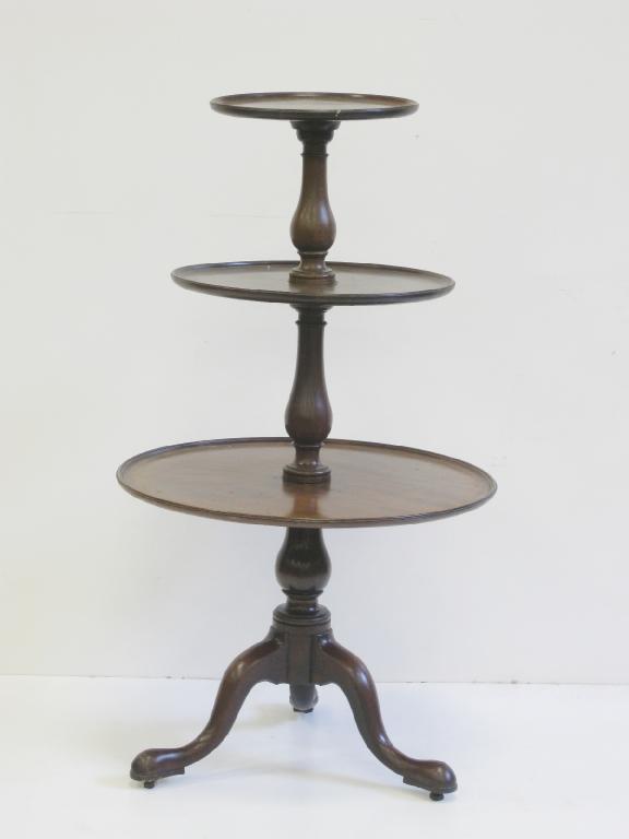 Appraisal: A George III mahogany three tier circular revolving Dumb Waiter