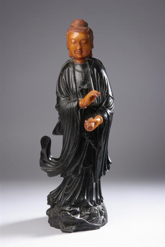 Appraisal: CHINESE SOAPSTONE AND ZITAN FIGURE OF COURT LADY Standing on