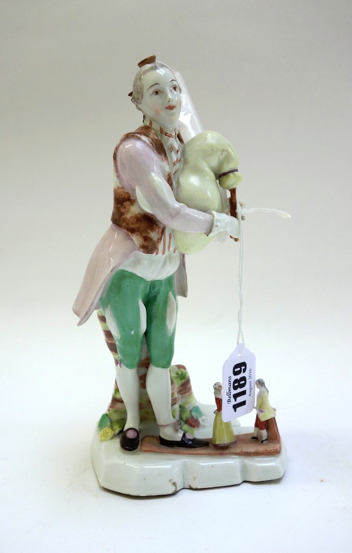 Appraisal: A Vienna figure of a bagpipe player circa with blue