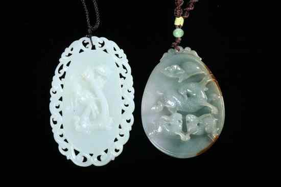 Appraisal: TWO CHINESE CELADON PENDANTS One with a dragon decoration within