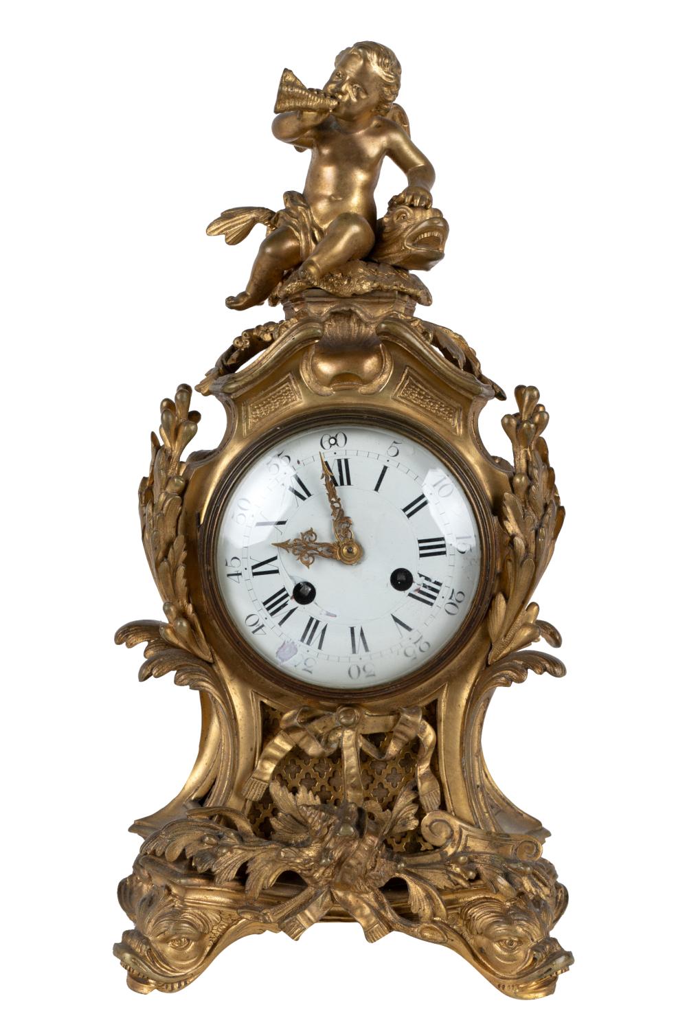 Appraisal: GILT BRONZE CHERUB CLOCKCondition with losses to porcelain dial wear