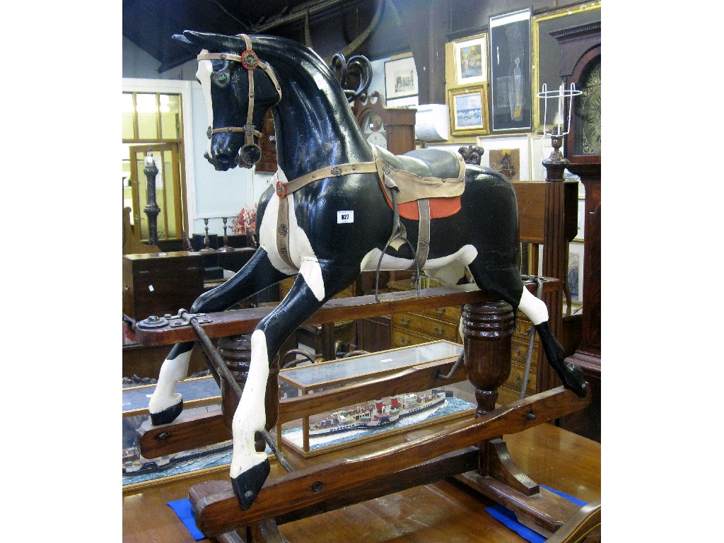 Appraisal: Rocking horse with painted decoration on oak base