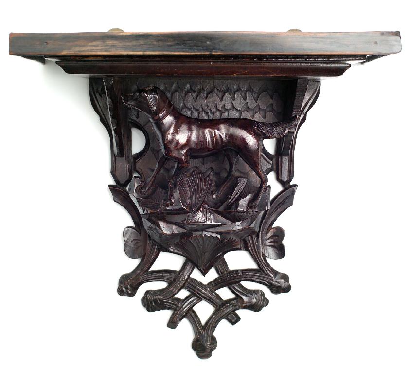 Appraisal: BLACK FOREST WALL BRACKET LATE th CENTURY the rectangular shelf