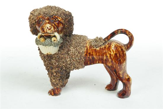 Appraisal: BENNINGTON POODLE Vermont mid th century Poodle holding fruit basket