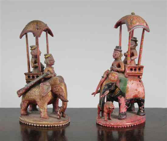 Appraisal: Two th century carved and painted ivory chess pieces probably