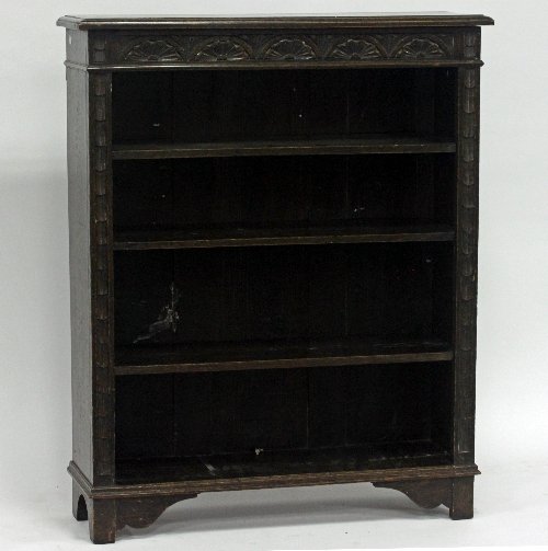 Appraisal: An oak bookcase with carved frieze cm wide