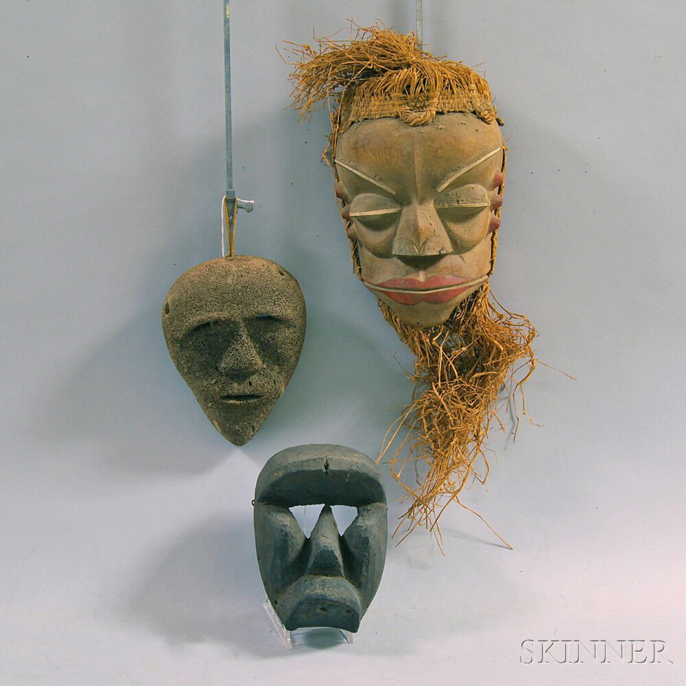 Appraisal: Three Carved Ethnic Masks two wood one with straw beard