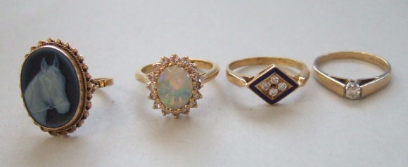 Appraisal: A gold opal and diamond set oval cluster ring a