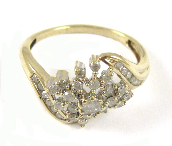 Appraisal: DIAMOND AND TEN KARAT GOLD RING set with round-cut diamonds