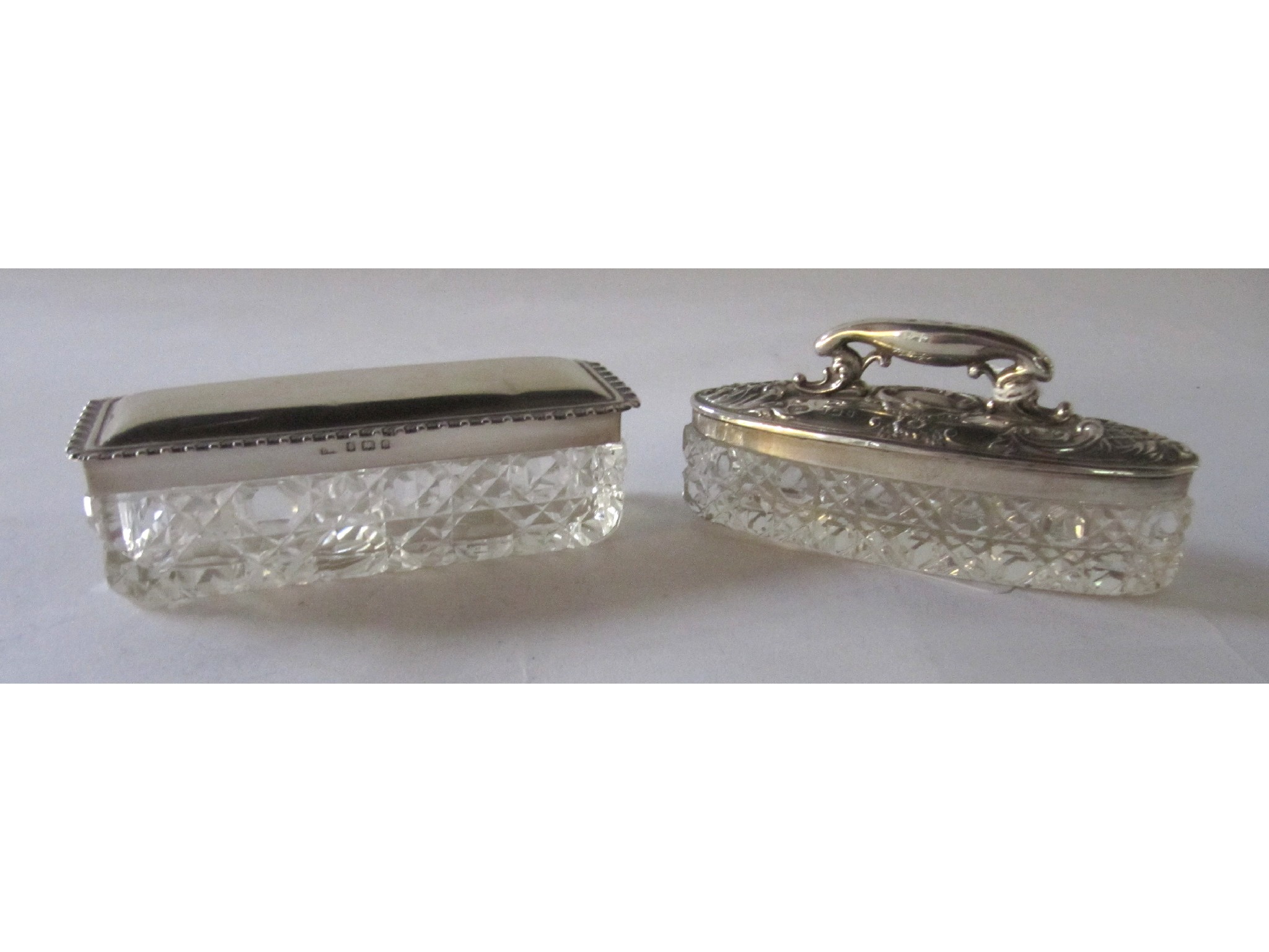 Appraisal: A lot comprising two silver topped trinket dishes Birmingham and