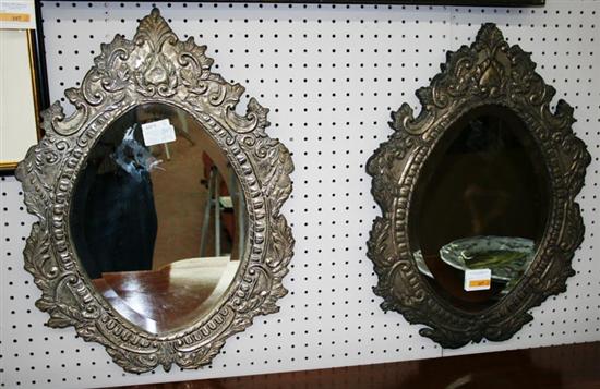 Appraisal: Pair silverplate framed mirrors fancy pressed metal frame with scrolling