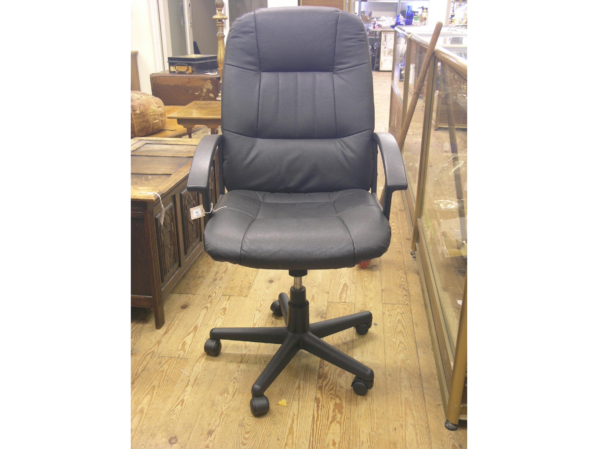 Appraisal: A modern office elbow chair padded leatherette on revolving frame