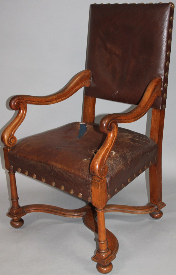 Appraisal: A thC oak armchair the back and seat overstuffed in