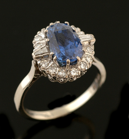 Appraisal: A sapphire and diamond cluster ring The art deco style