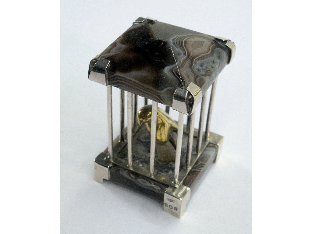 Appraisal: Silver and agate model of a bird in a cage