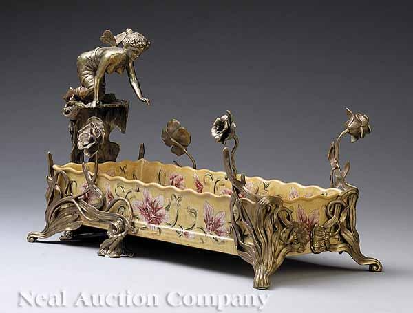 Appraisal: An Art Nouveau-Style Porcelain and Bronze-Mounted Figural Jardini re th