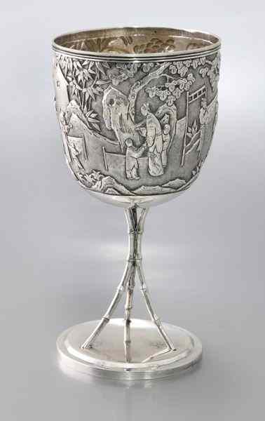 Appraisal: Chinese Qing silver trophy goblet the chased body depicting figures