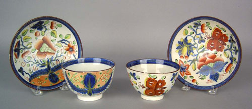 Appraisal: Two Gaudy Dutch cups and saucers in the butterfly and