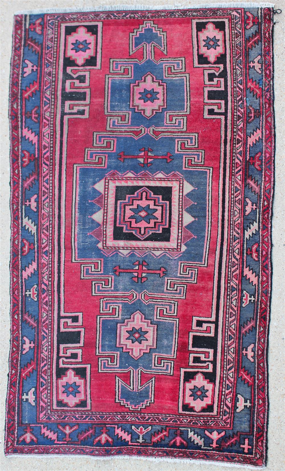 Appraisal: ANTIQUE TRIBAL RUG geometric design in blue beige coral and