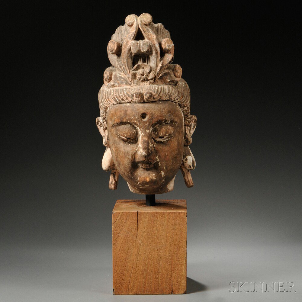 Appraisal: Polychrome Carved Wood Head of Guanyin China the Bodhisattva depicted