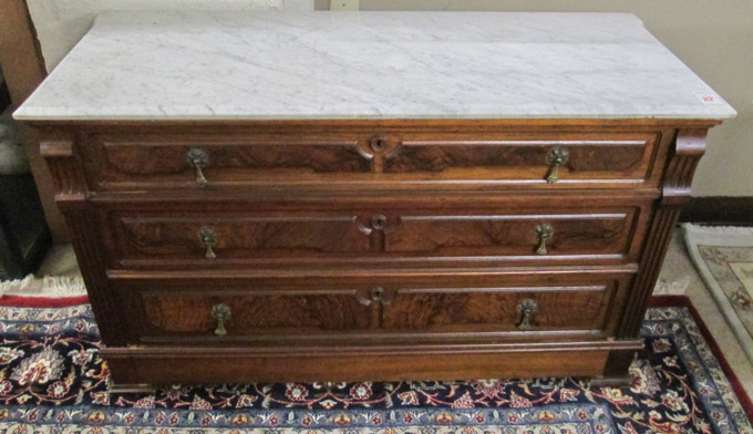 Appraisal: A VICTORIAN MARBLE-TOP WALNUT DRESSER American c having a rectangular