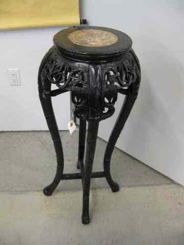 Appraisal: Chinese Carved Teak Stand marble insert bamboo foliage design ''