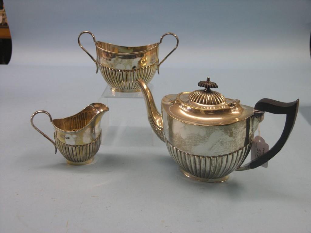 Appraisal: A silver three-piece teaset oval half-fluted form Sheffield approx oz