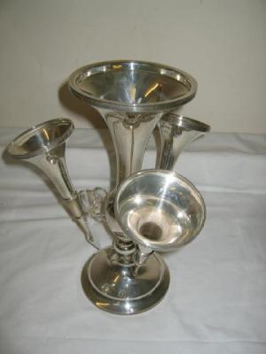 Appraisal: AN EPERGNE with central trumpet base on baluster turned stem