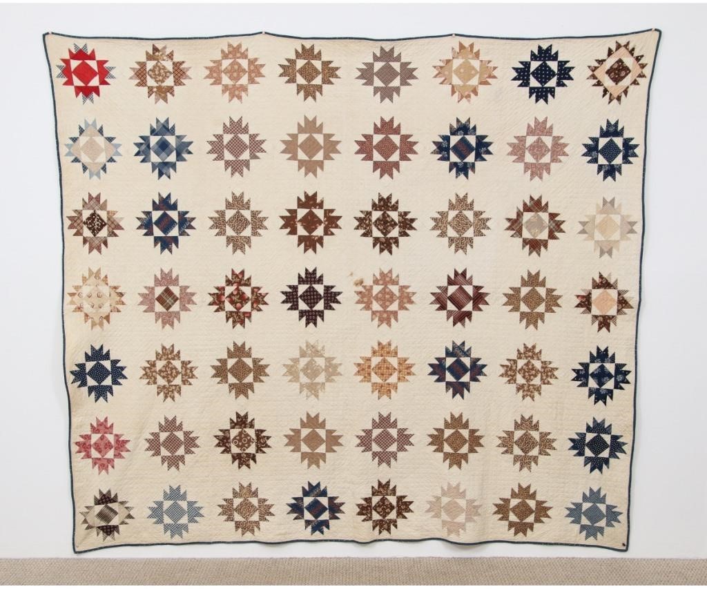 Appraisal: Pieced quilt in colorful snowflake pattern with extensive quilting x