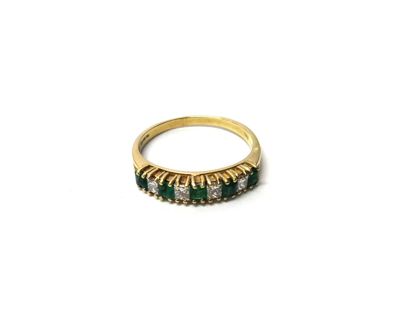 Appraisal: An ct gold emerald and diamond set nine stone half