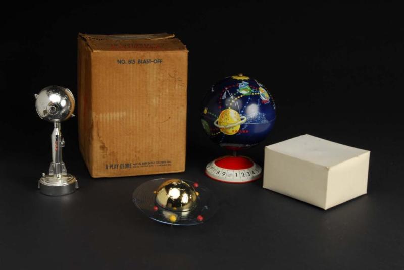 Appraisal: Tin Banks w Boxes Description includes Tin Blast-Off Planetary Globe