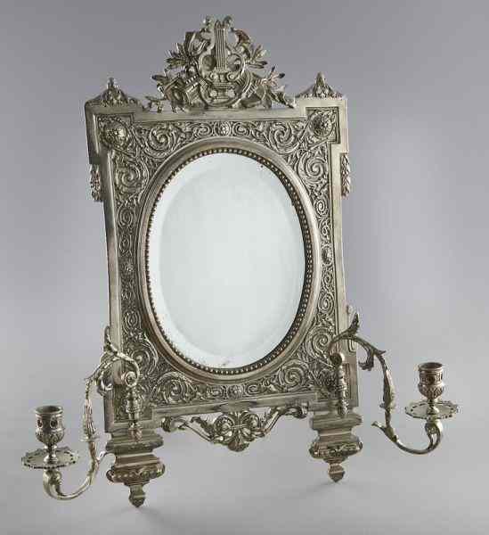 Appraisal: Silver plate vanity mirrorwith two scrolled candle arms the pierced