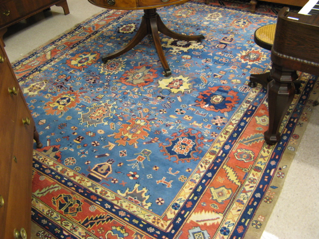 Appraisal: HAND KNOTTED PERSIAN CARPET repeating geometric medallion and overall stylized