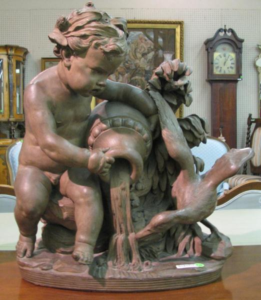 Appraisal: Cast Metal Sculpture depicting Putti and Goose with bronzed finish