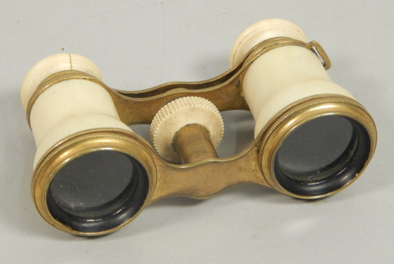 Appraisal: A pair of late thC ivory opera glasses by Chevalier