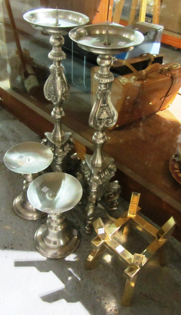 Appraisal: A pair of th century white metal altar candlesticks two