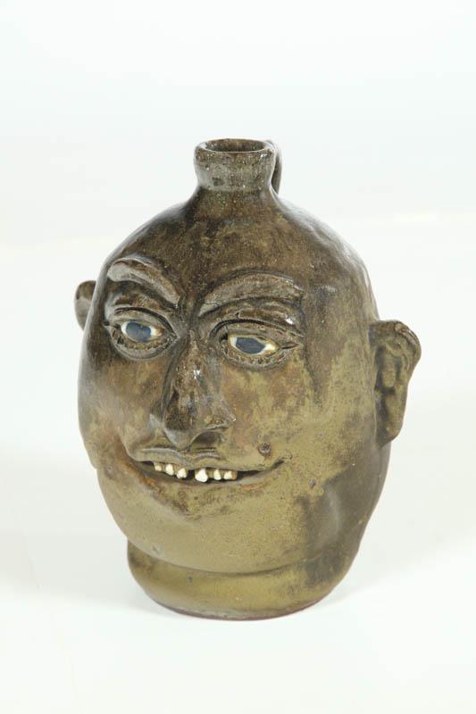 Appraisal: GROTESQUE JUG Georgia th century clay Signed Lanier Meaders -