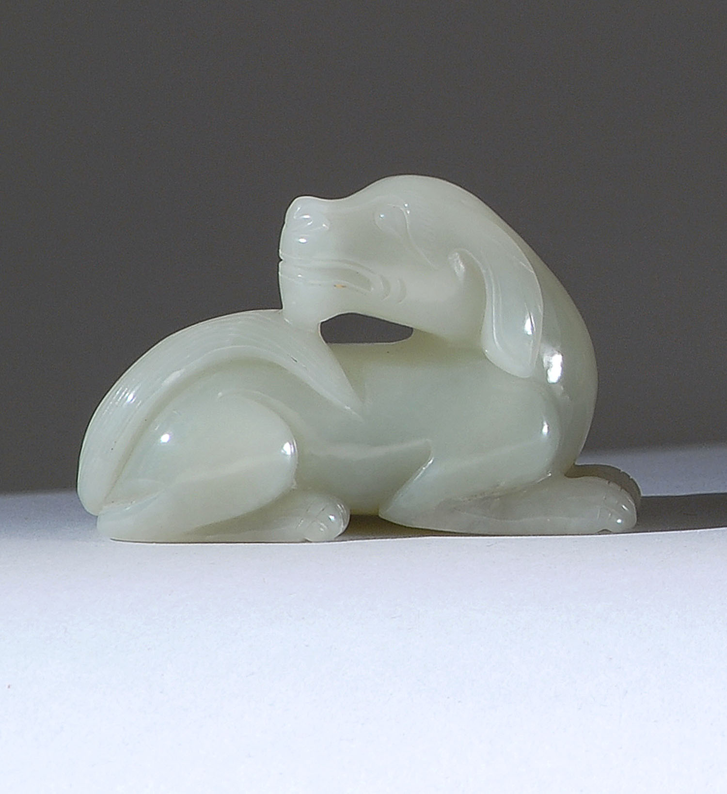 Appraisal: CELADON JADE CARVING th CenturyIn the form of a reclining