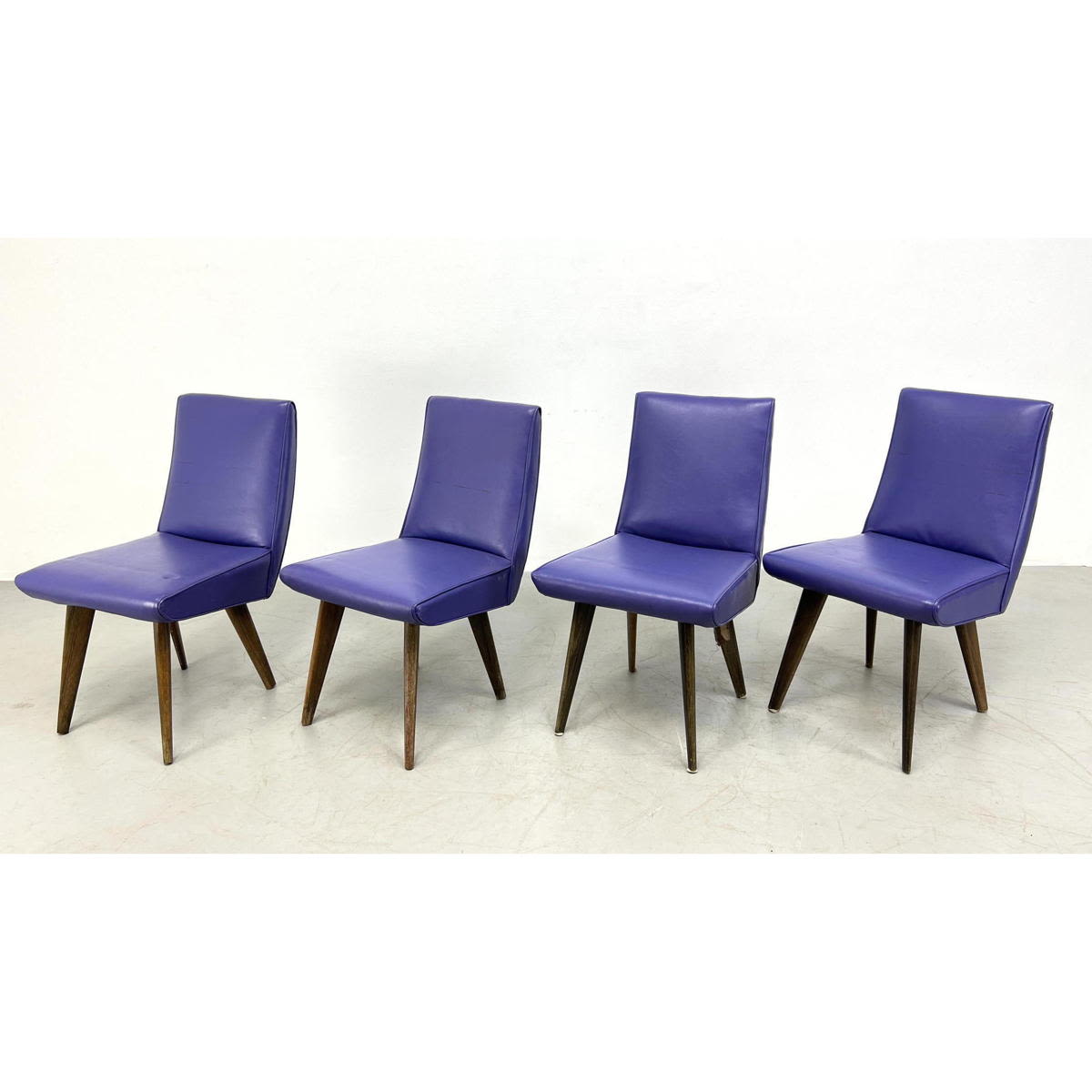 Appraisal: Set vintage vinyl purple chairs Studded around side Tapered Angular