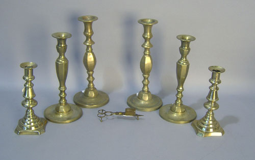 Appraisal: Three pair of brass candlesticks together with a snuffer