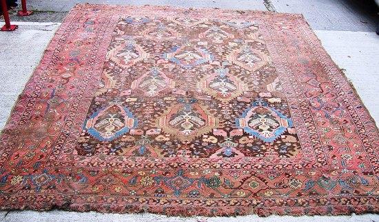 Appraisal: An Agra carpet with stylised central field within a broad