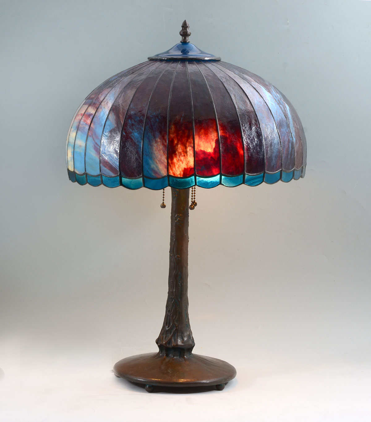 Appraisal: BLUE RED STAINED GLASS SIGNED DESK LAMP Blue red curved