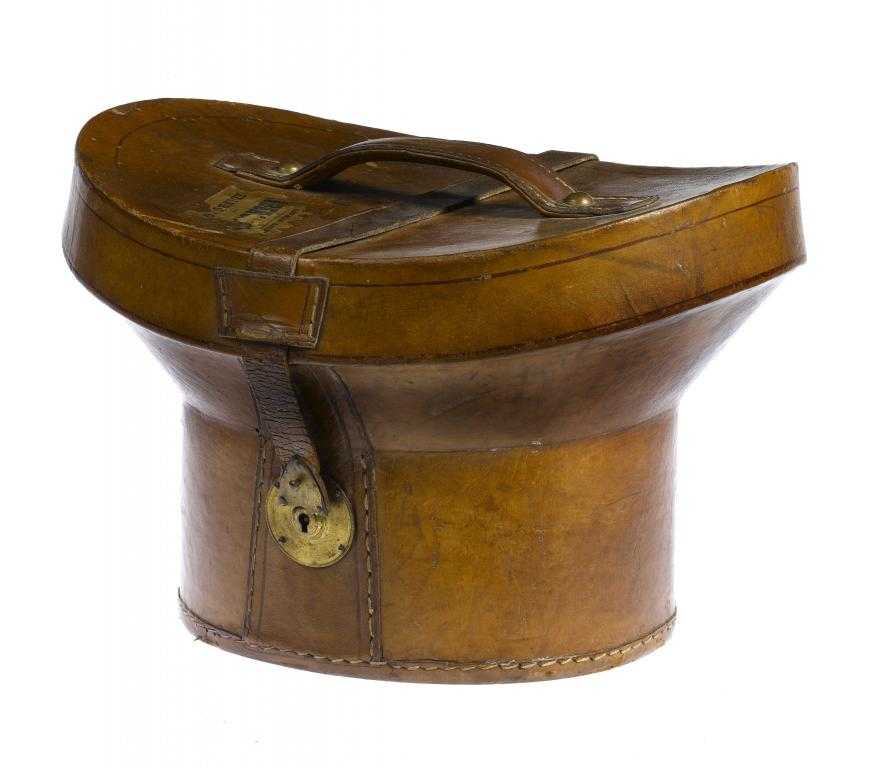 Appraisal: A BRASS MOUNTED LEATHER TOP HAT CASE with part luggage