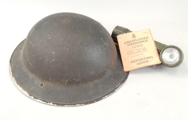 Appraisal: Military items to include an air warden's helmet torch and