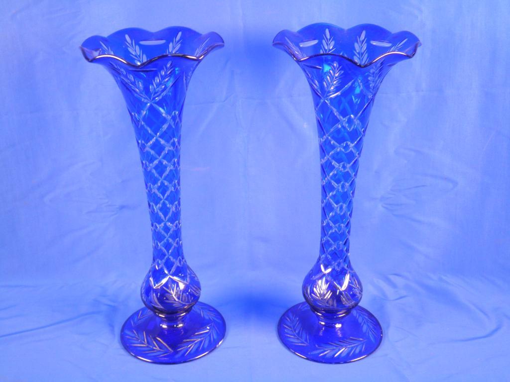 Appraisal: A pair of Bohemian type blue overlay glass vases each