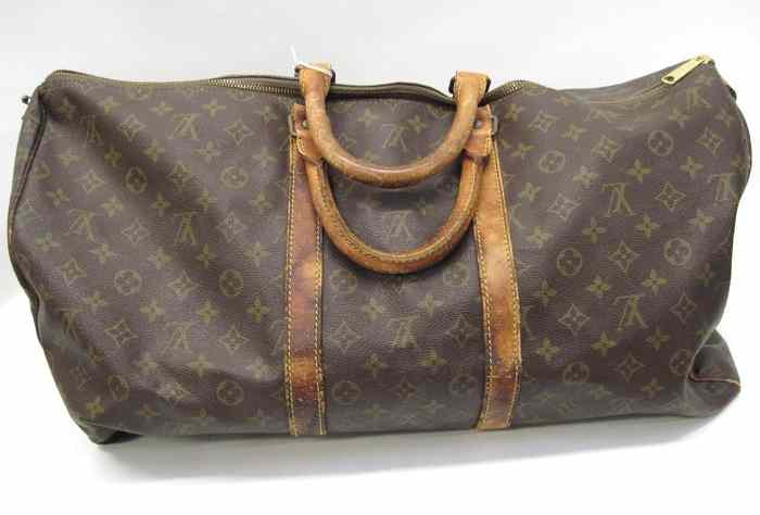 Appraisal: LOUIS VUITTON ''KEEP ALL'' BANDOULIERE DUFFLE BAG monogram canvas interior