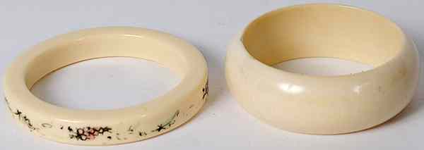 Appraisal: Ivory Bangles th century Two ivory bangles one with painted