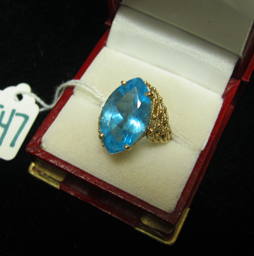 Appraisal: TOPAZ AND TEN KARAT GOLD SOLITAIRE RING centering a marquise-cut