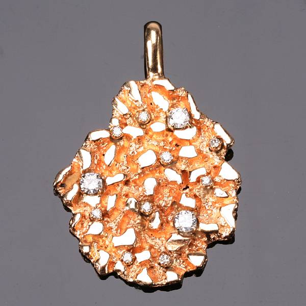 Appraisal: A diamond and fourteen karat gold pendant nugget style set